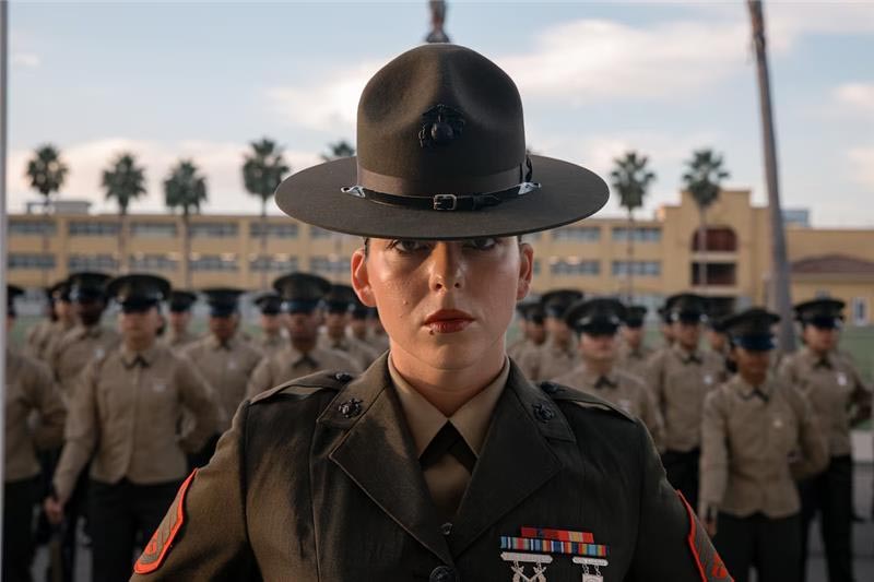 Marines in uniform rendering a salute